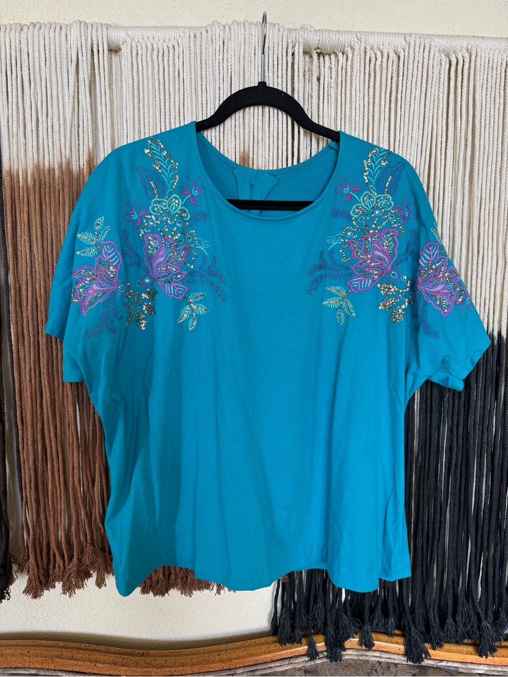 Blue sequin top with floral design; excellent condition